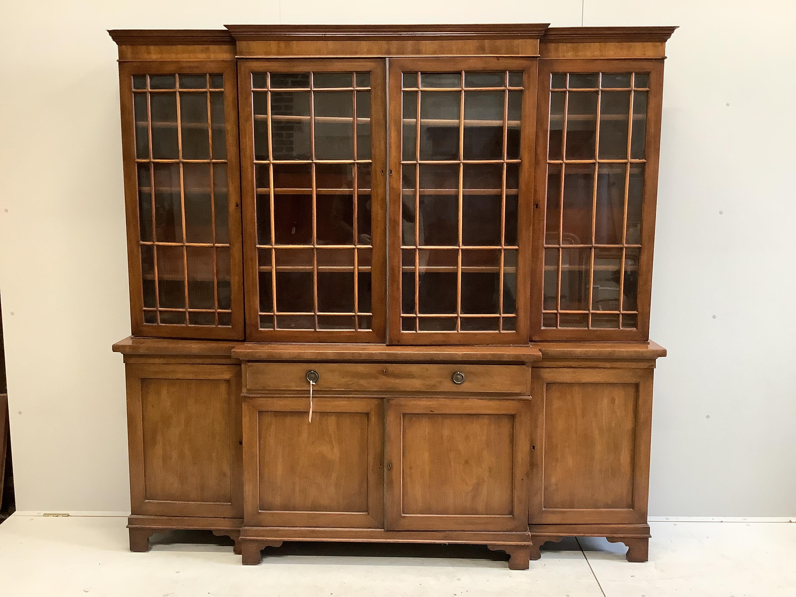 An early 19th century mahogany breakfront library bookcase stamped James Winter, Wardour St, London and numbered 12931, width 206cm, depth 39cm, height 199cm